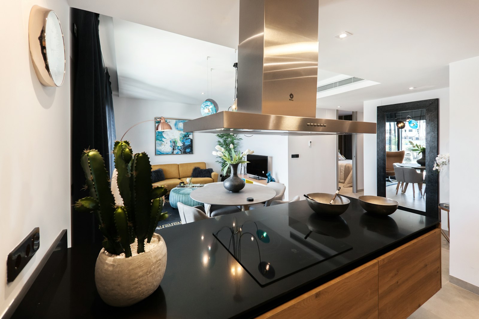 Open-plan furnished family apartment with dining area, representative example